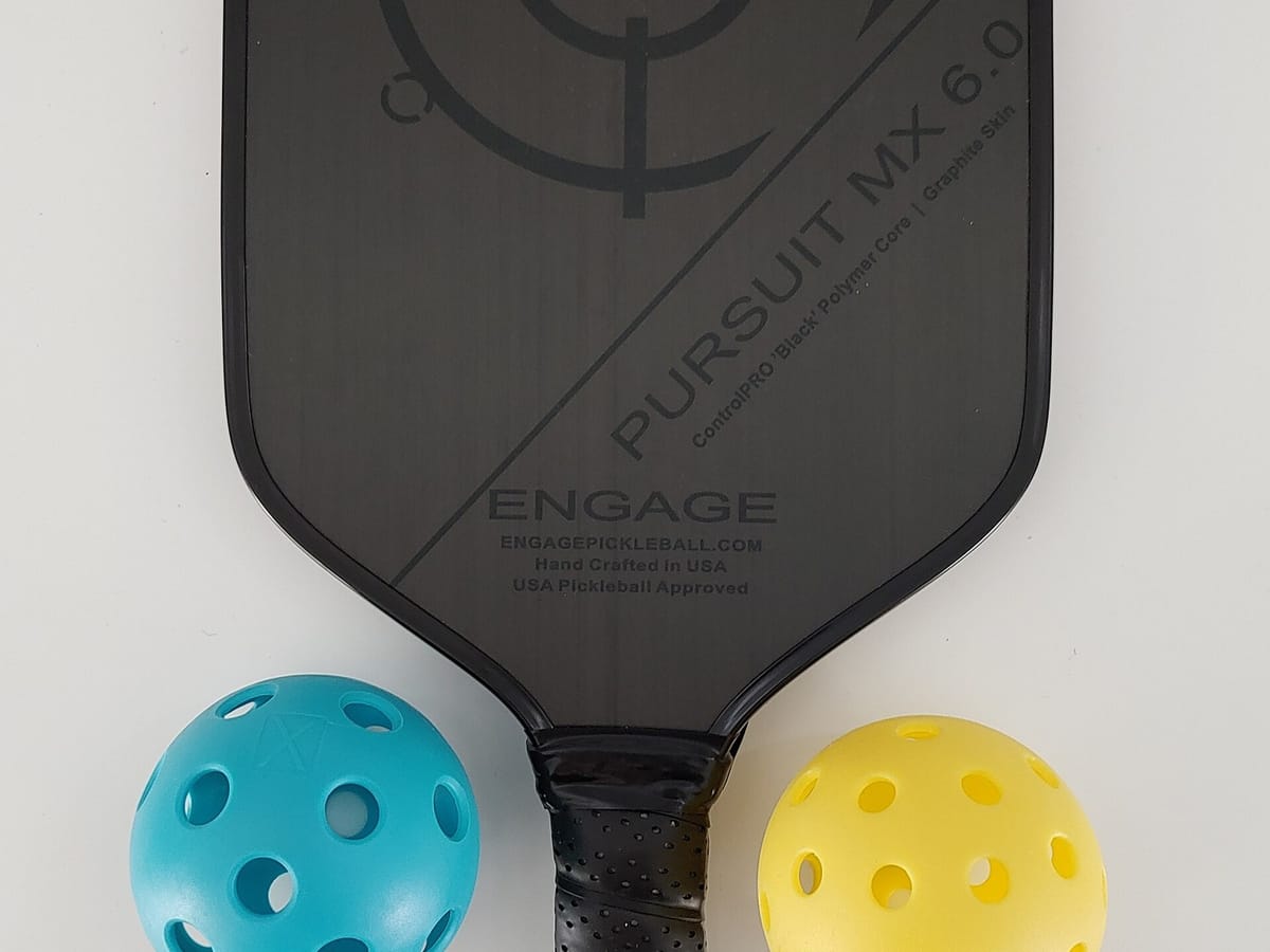 Indoor and outdoor pickleballs side by side