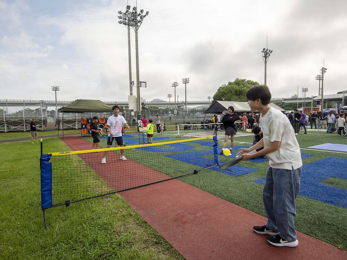 A family playing pickleball